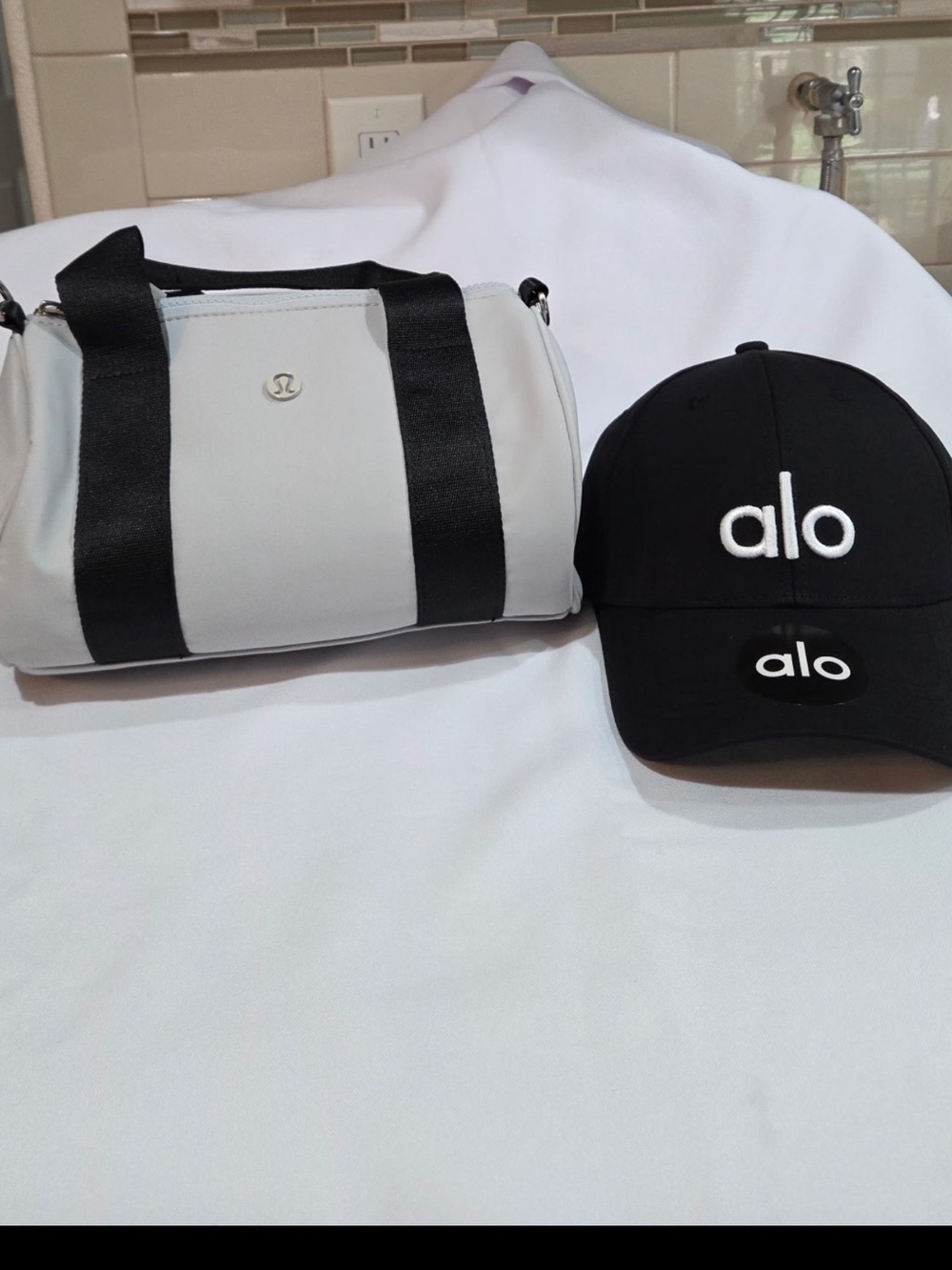 Lululemon White & Black Duffle with Alo Black Hat